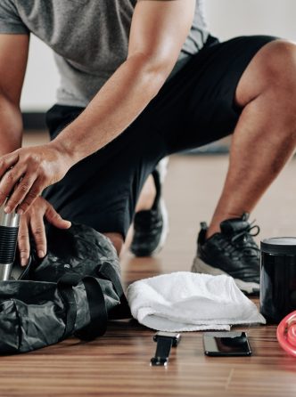 Sportsman packing gym bag